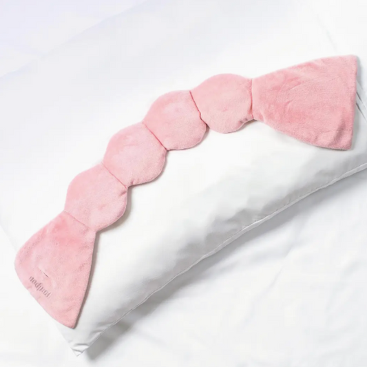 Experience tranquility with Nod Pod's Weighted Sleep Mask, blocking out light for a peaceful night's sleep.