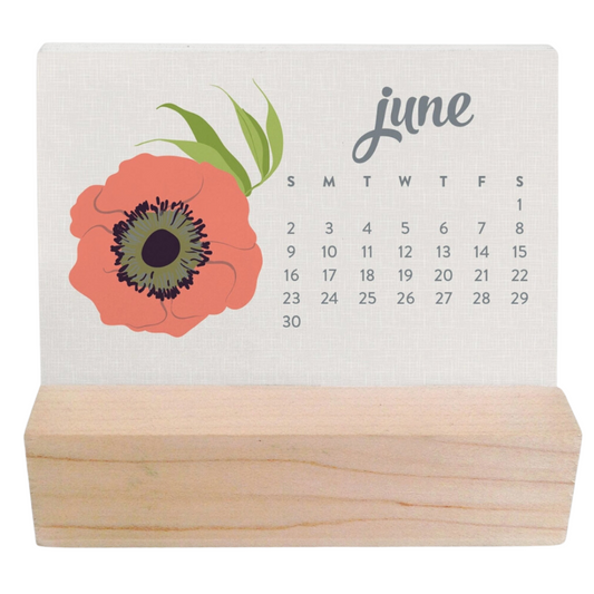 Compact wooden desk calendar adorned with beautiful flowers, a stylish and practical addition to your workspace.