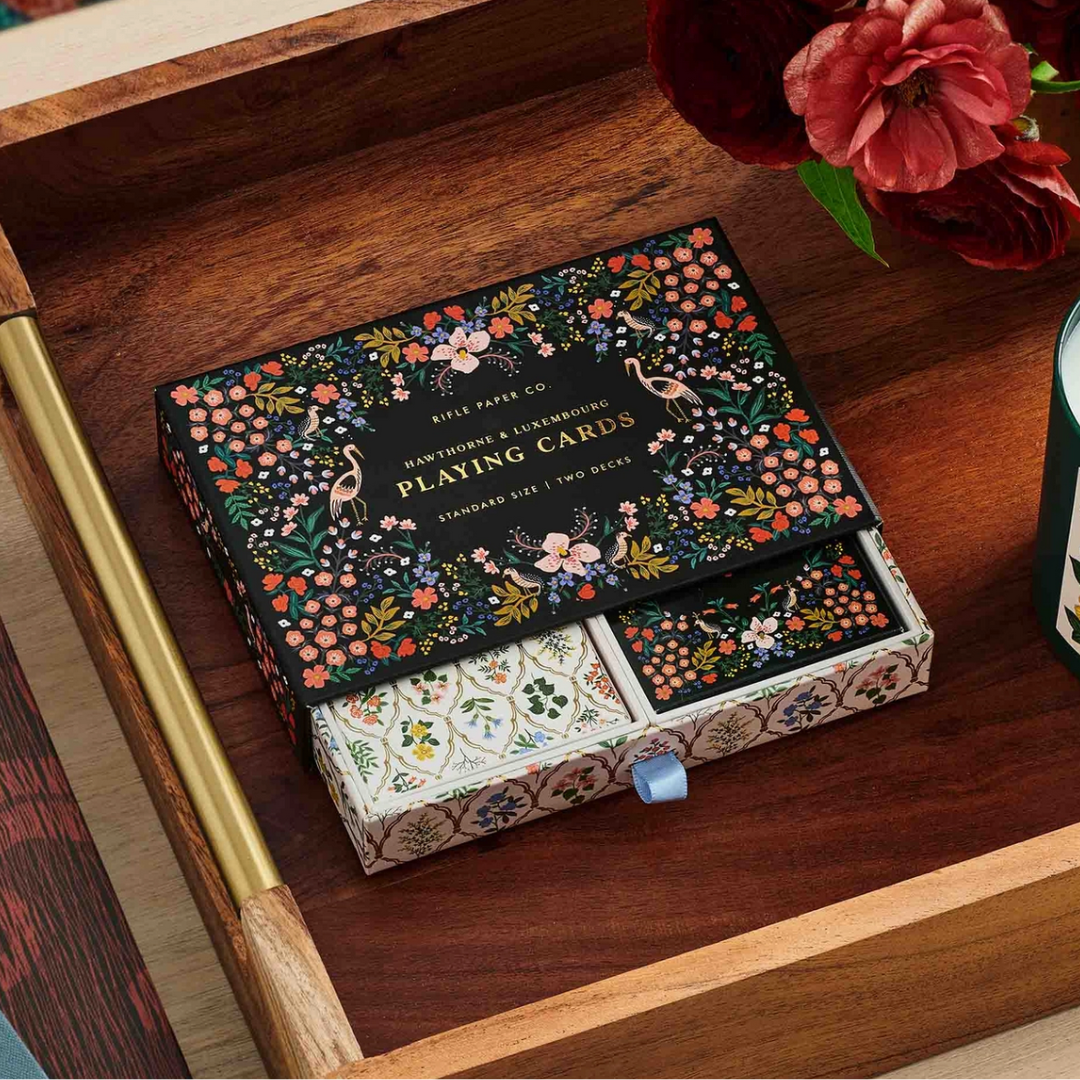 Cards stored in floral box with ribbon.