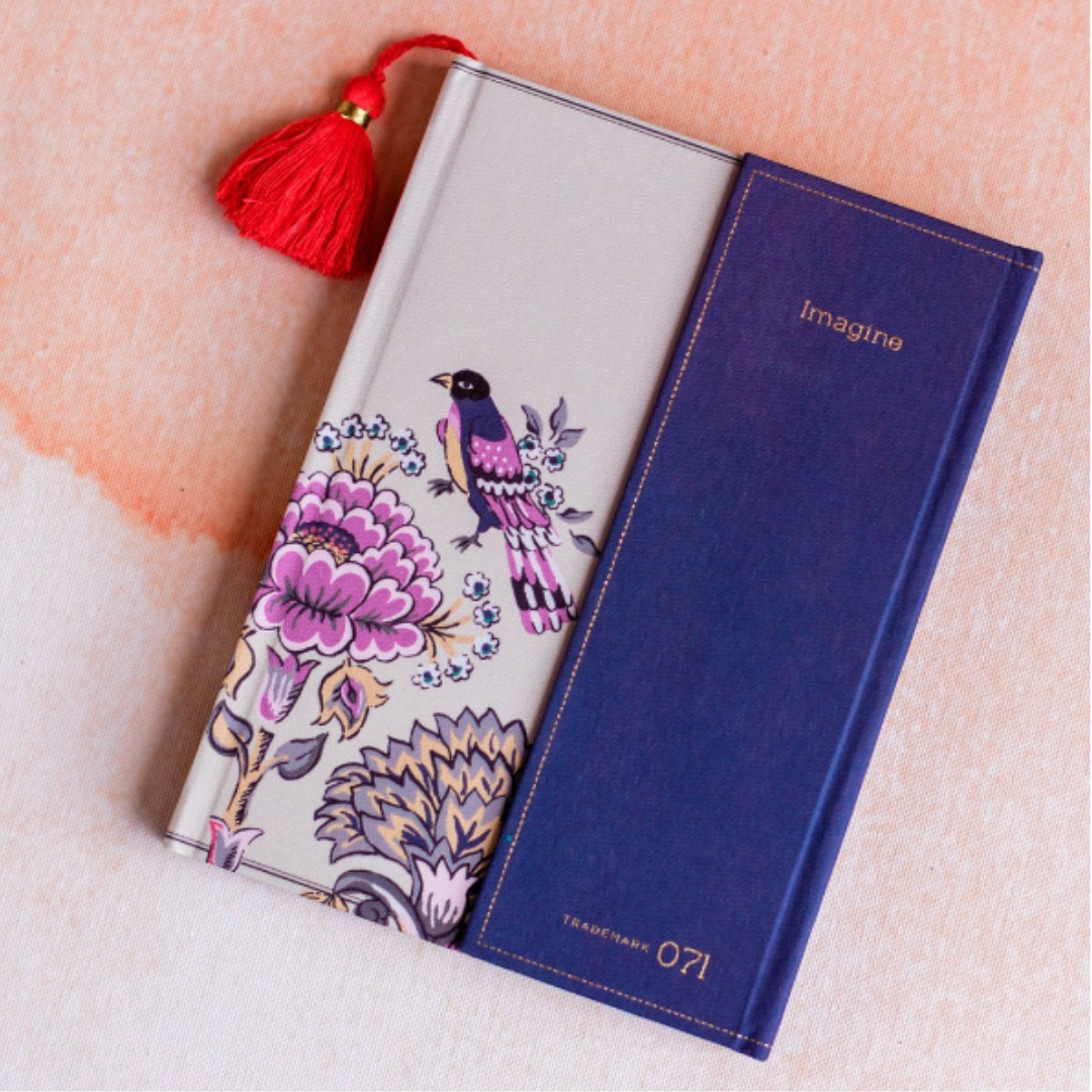 Lavender linen journal adorned with a vibrant tassel, inviting creativity and capturing the essence of tranquility.