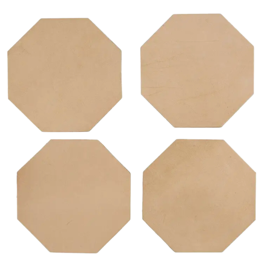 Four elegant octagon shaped leather coasters, perfect for protecting surfaces with a hint of luxury.