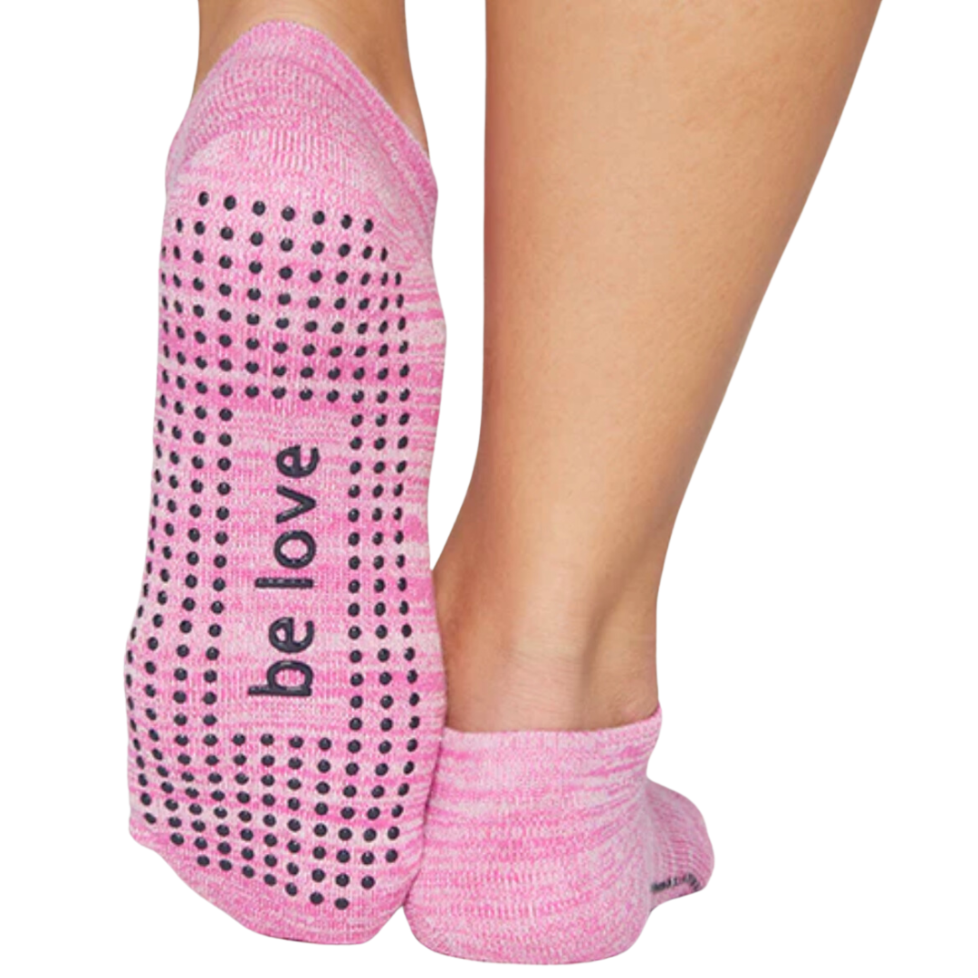 Stylish pink Sticky Be sock featuring "Be Love" text for enhanced grip and support during fitness activities.
