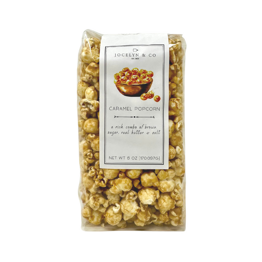 A tempting 6oz bag of Vanilla Caramel Popcorn, featuring a delightful blend of sweet vanilla and rich caramel flavors. The packaging showcases a mouthwatering image of golden popcorn coated in a luscious caramel glaze, promising a perfect treat for your taste buds.