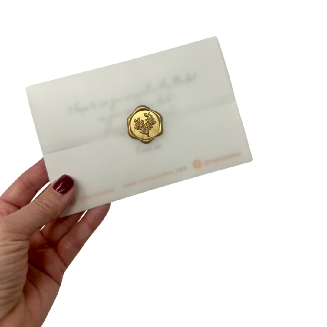 Four inch by six inch personal gift message card included in Me To You Box's curated gift boxes. The card is wrapped in delicate vellum and sealed with a round gold wax seal.