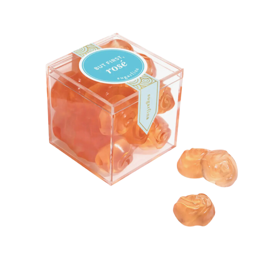 Delicious But First Rosé gummy roses in a chic acrylic cube from Sugarfina, a sweet treat for a touch of luxury.