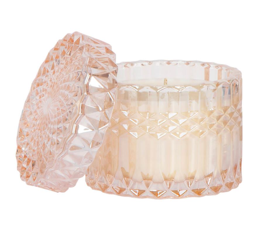 Chic soy wax candle in soft pink glass, vanilla rose aroma, and a coordinating lid.