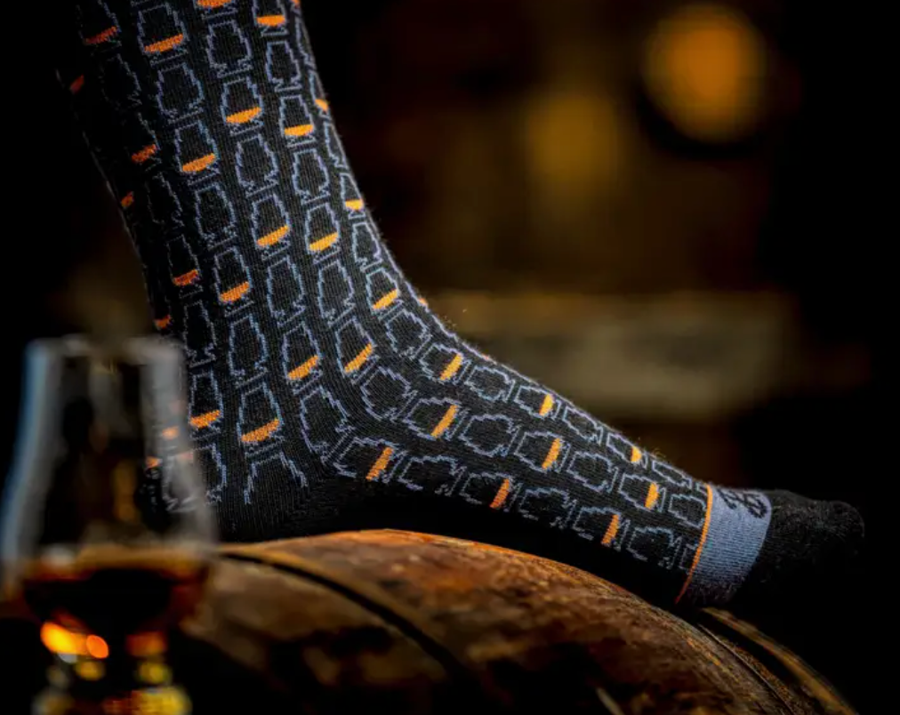Elevate your sock game with mid-calf dress socks adorned with stylish whiskey glasses, adding a tasteful and distinctive touch to your ensemble.