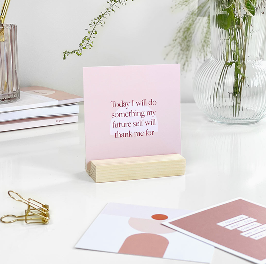 Beautifully crafted wooden stand displaying uplifting affirmation cards for daily inspiration.