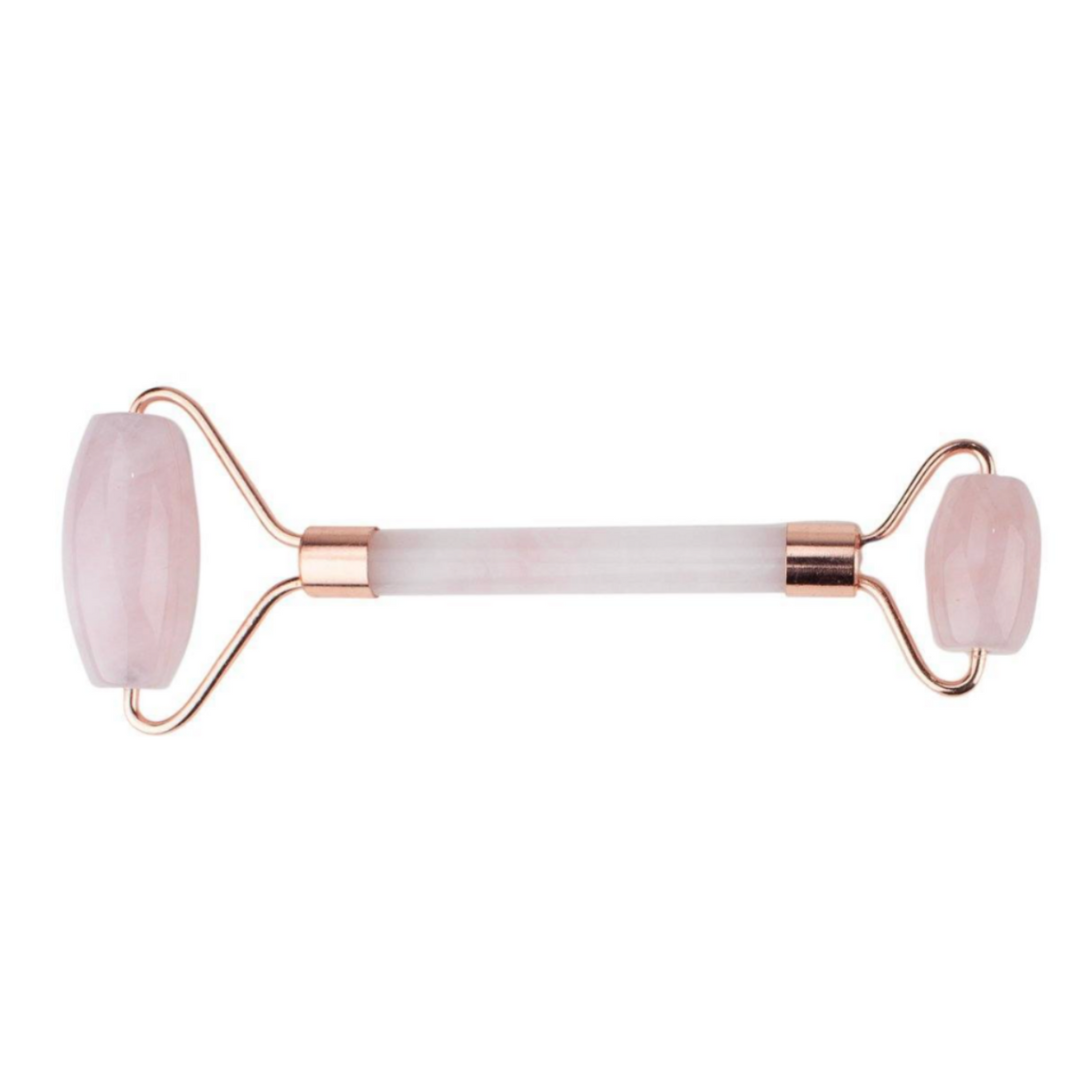 Rose quartz crystal facial roller: a soothing beauty tool for self-care, promoting relaxation and enhancing skincare routines.