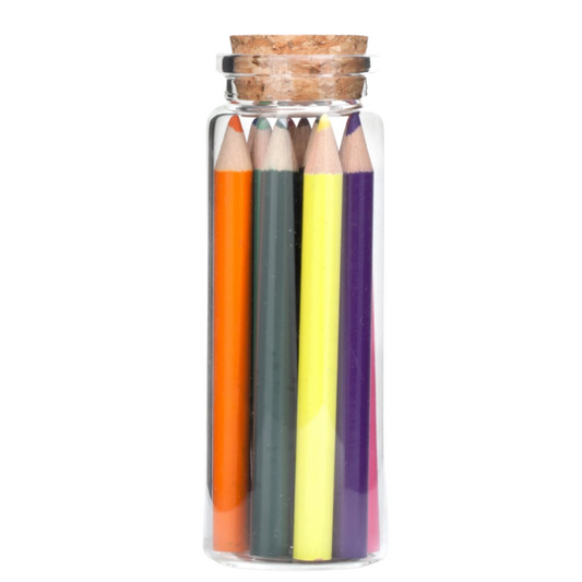 Colorful array of pencils in glass jar with cork lid, ready for artistic inspiration.
