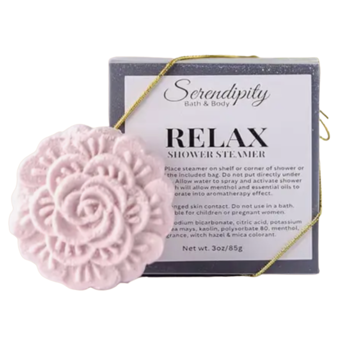 Close-up of vibrant pink Relax shower steamer, flower-shaped and releasing soothing aromas for a spa-like experience.