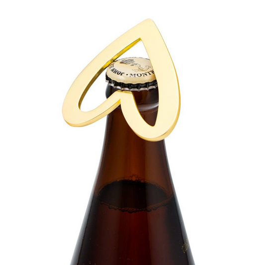 Elegant gold bottle opener shaped like a heart, adding charm to any occasion.