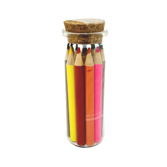 Vibrant colored pencils in a corked jar, perfect for coloring floral wonders in the adult coloring book.