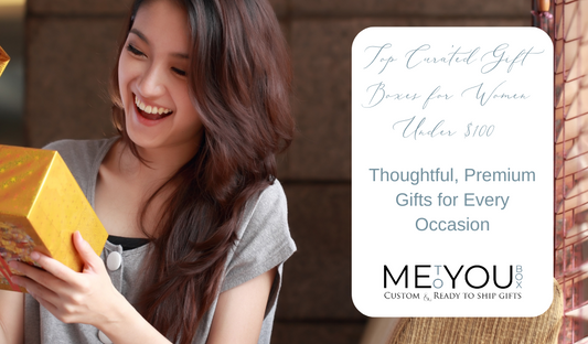 Your lady with long brown hair wearing a grey t shirt, smiling while holding and looking inside a yellow gift box.