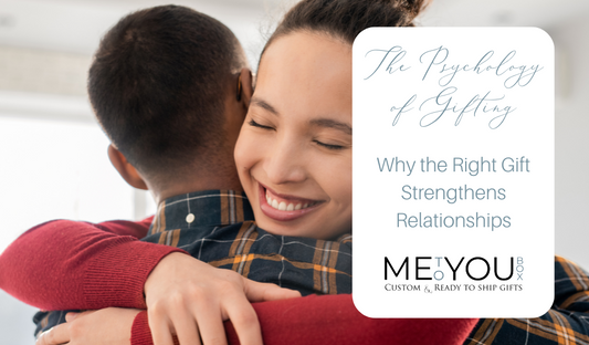 Two adults hugging and smiling.