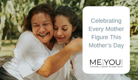 Mother and daughter hugging and smiling sitting on a park bench.