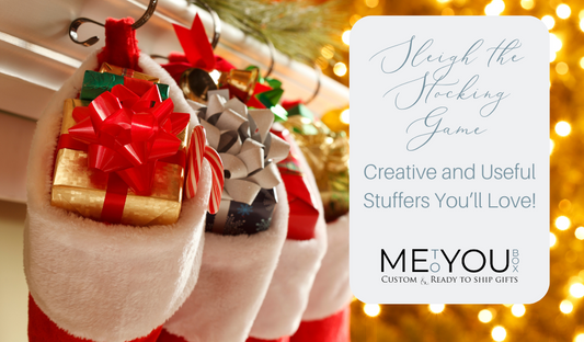 Four red and white Christmas stocking hanging on a mantel filled with gifts.