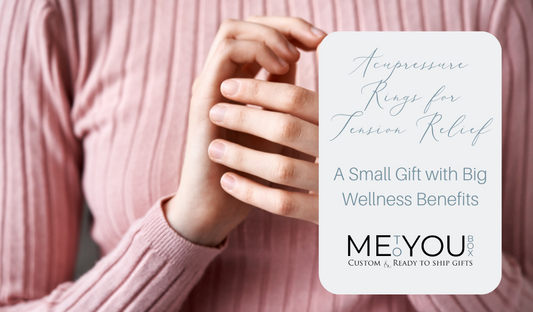 A woman standing with a pink long sleeve shirt rubbing her hands together to represent the use of acupressure rings for fingers to help relieve tension and anxiety.