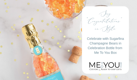 White table with gold glitter, corks and Sugarfina Champagne Gummy Bears.