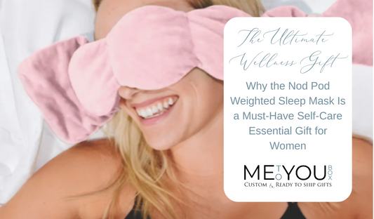 Pink Nod Pod weighted sleep mask on a woman's face who is smiling and laying on white bedding.
