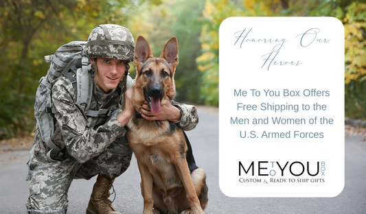 Military soldier smiling and kneeling by a dog. 