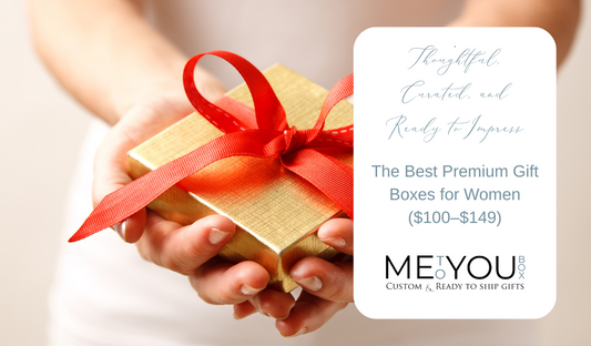 Woman in a white dress holding out a gold gift box wrapped in red ribbon.