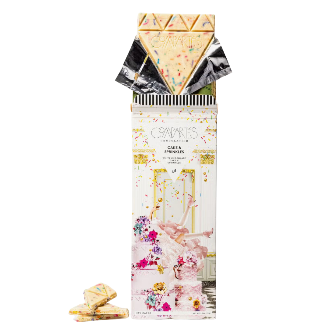 Compartes White Chocolate Bar: Indulgent treat with cake-filled bliss and colorful sprinkles.