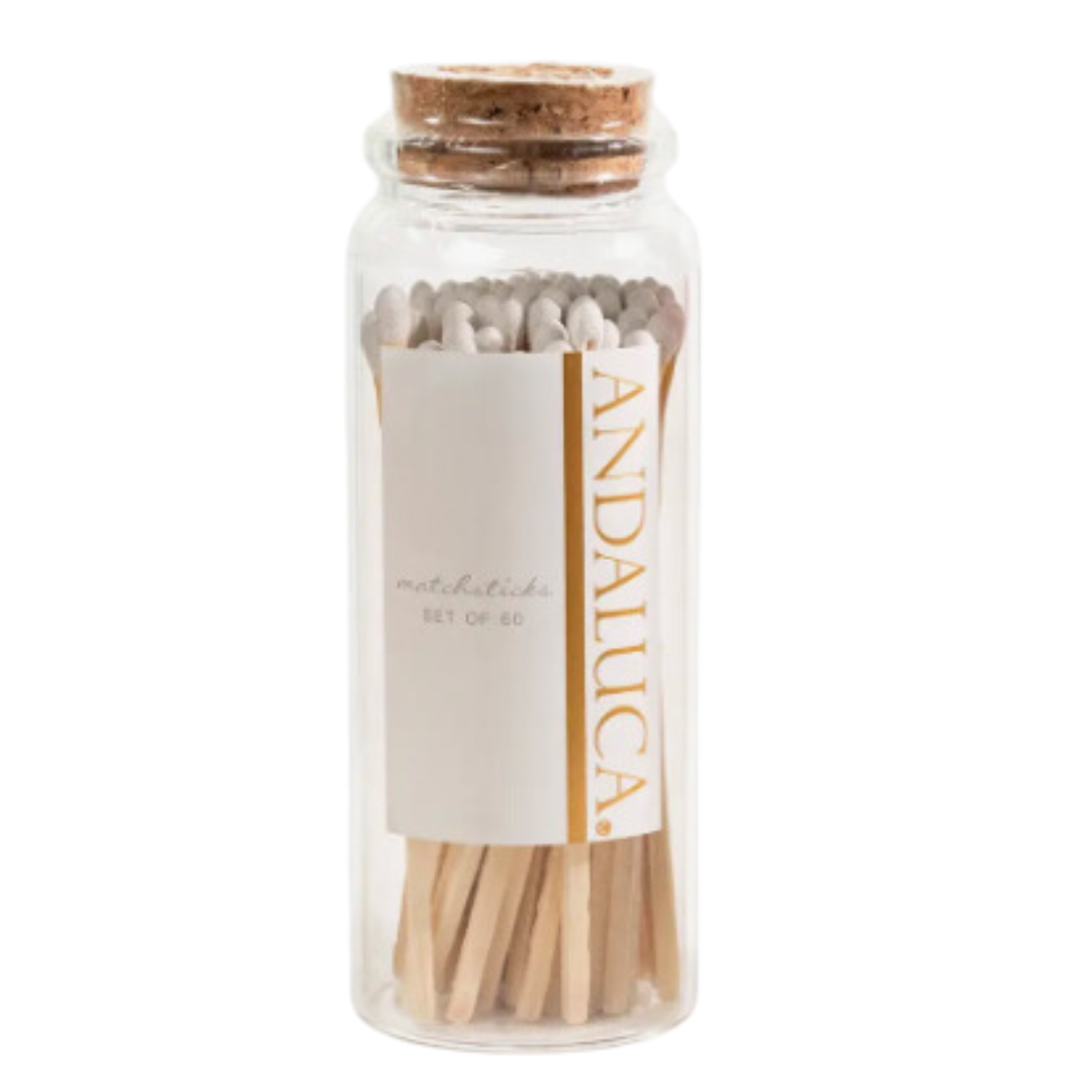 Clear glass jar with cork lid, holding 60 white-tipped matches, each 5 inches long.