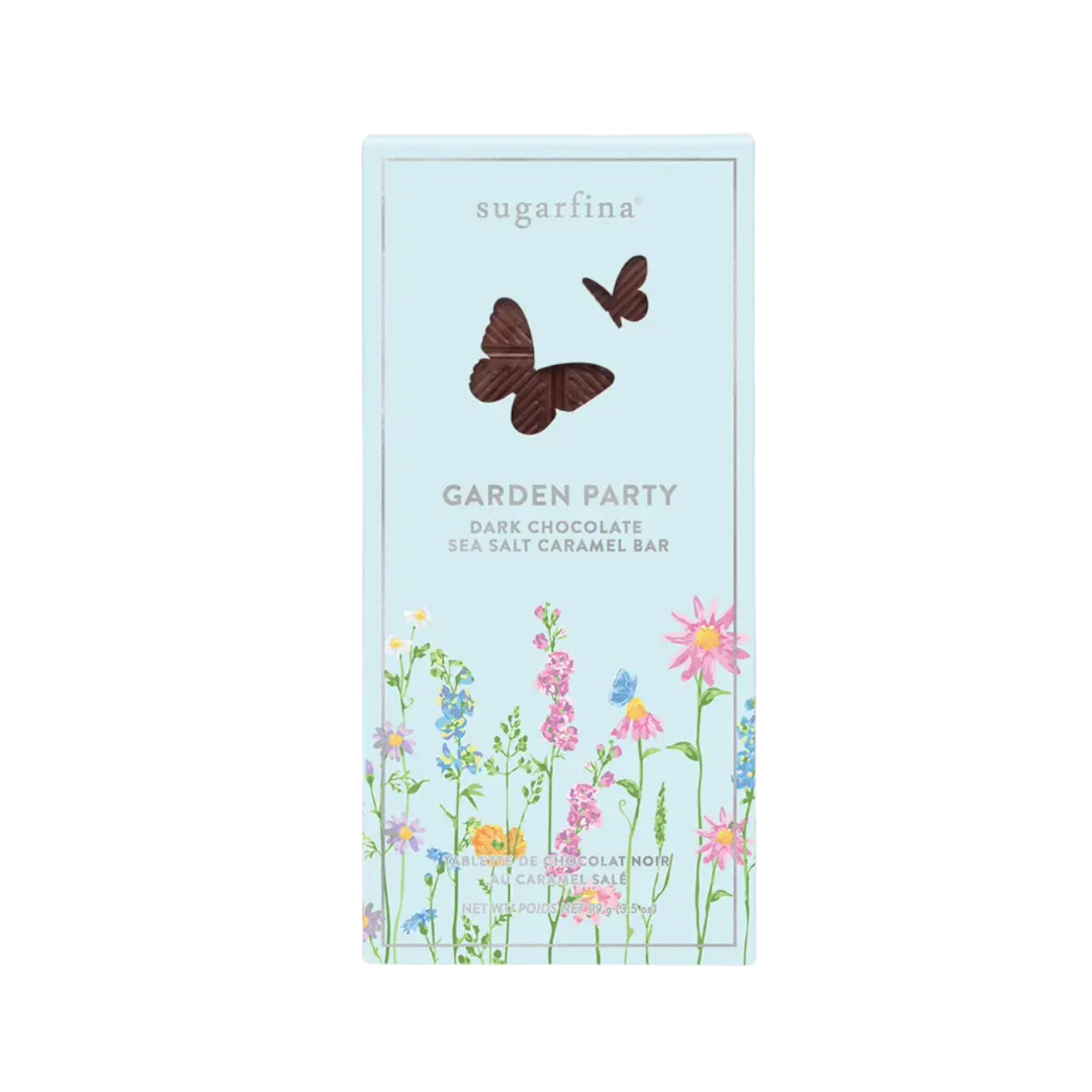 Dark Chocolate Salted Caramel Chocolate Bar by Sugarfina: Blue packaging adorned with vibrant flowers and a cut-out butterfly. Shop this delightful treat online at Me To You Box for a sweet experience delivered to your door.