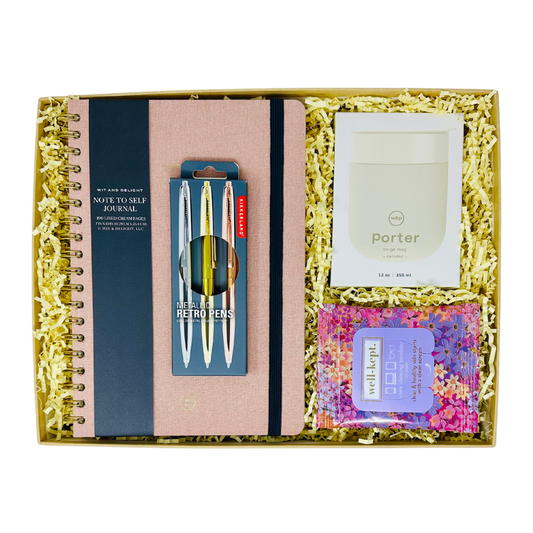 Me To You Box's Office Essentials gift set displayed with a linen journal, ceramic and silicone coffee mugs, metal pens, and screen cleaner wipes, arranged neatly in a decorative box.