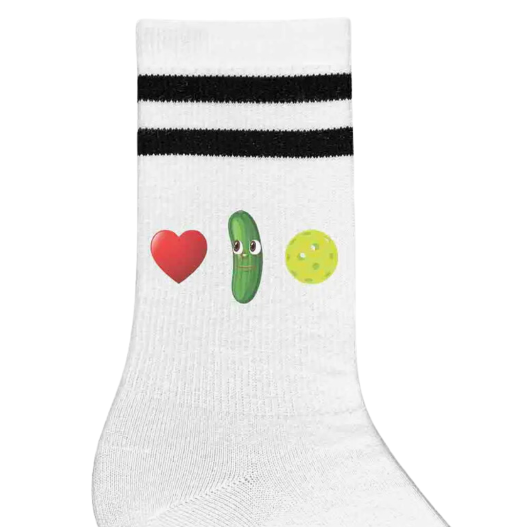 Graphic depiction on women's crew pickleball socks showcasing a heart, pickle, and pickleball, conveying adoration for pickleball.