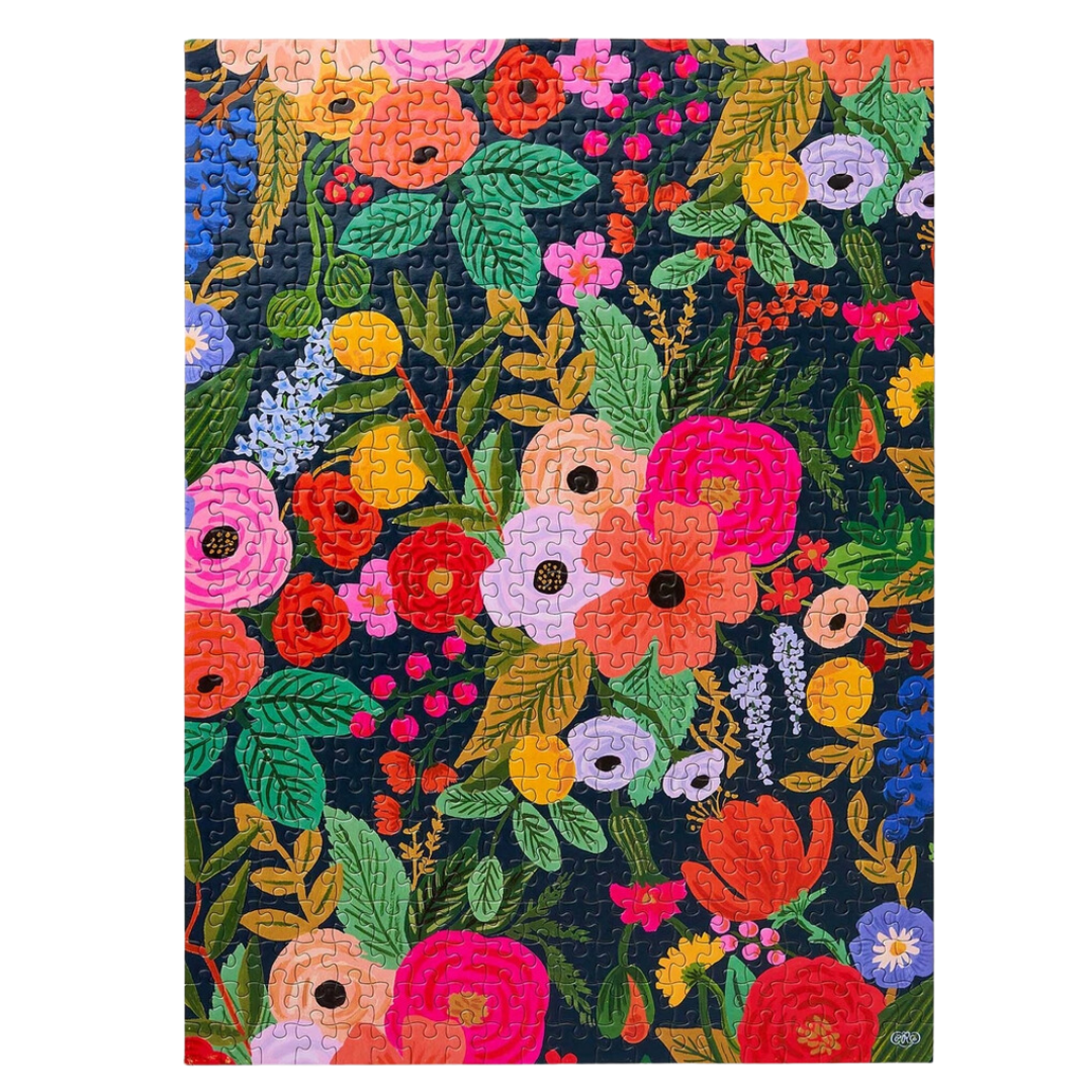 500 piece puzzle of a lush garden scene with vibrant flowers and greenery.