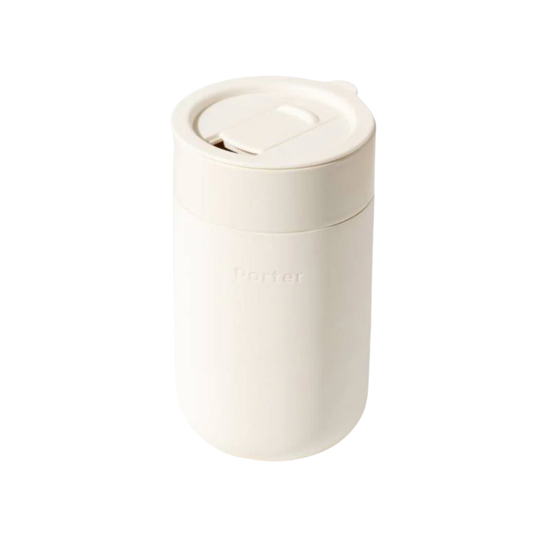 A cream-colored 16 oz mug wrapped in silicone for a comfortable grip, featuring a sleek and modern design.