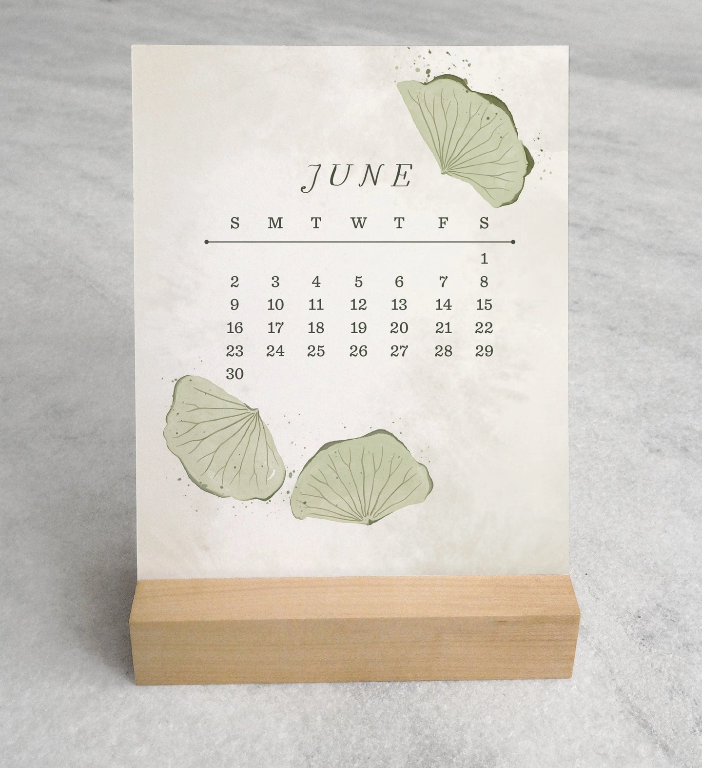 The 2025 Desk Calendar from Me To You Box, featuring 4.25" x 5.5" cards with unique monthly designs and a durable maple wood stand. This compact calendar fits perfectly on any desk, offering daily inspiration and organization with a touch of aesthetic charm.