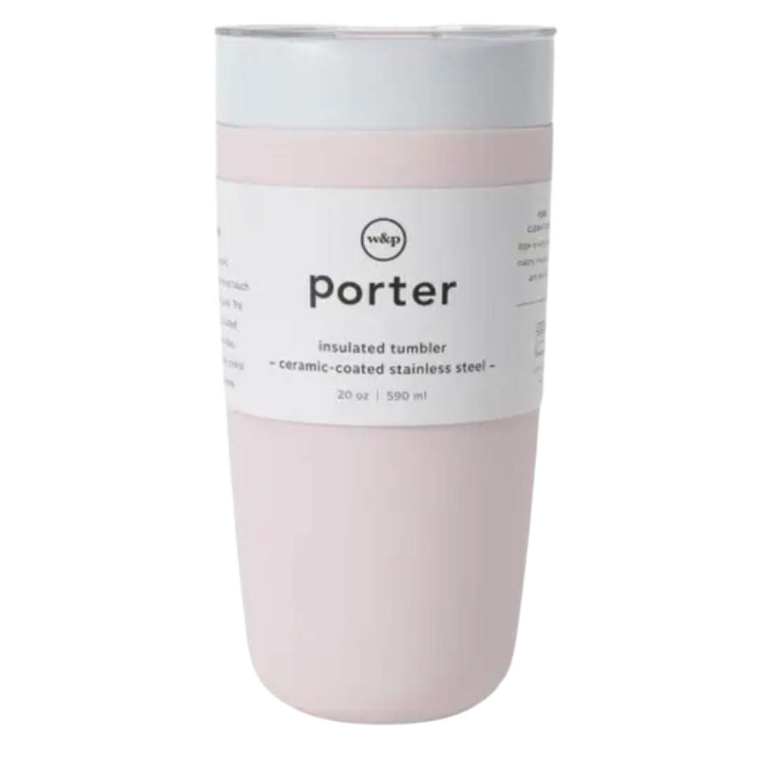 A 20oz pink silicone-wrapped ceramic reusable tumbler by Porter W&P. The tumbler features a ceramic body, wrapped with a smooth pink silicone sleeve for a secure grip. Contains a sliding lid top.