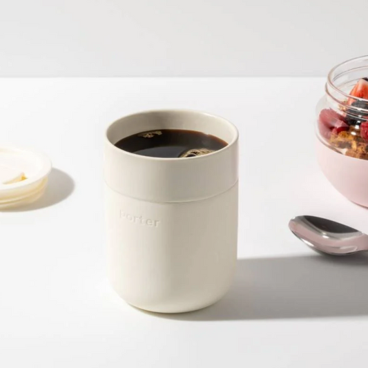 12 oz white ceramic mug with a cream silicone sleeve, showcasing a sleek and modern design by W&P.