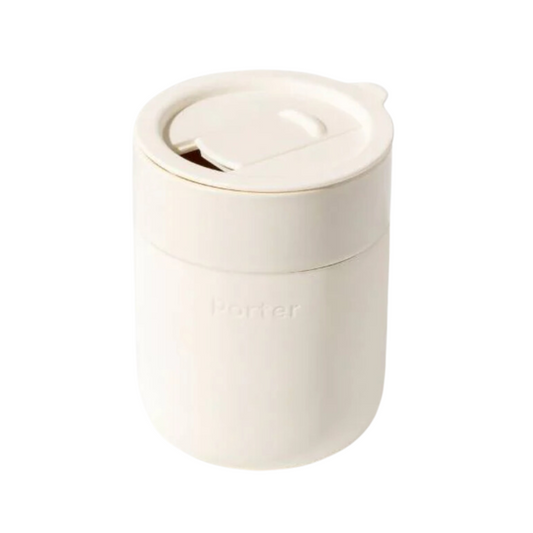 12 oz white ceramic mug with a cream silicone sleeve, showcasing a sleek and modern design by W&P.
