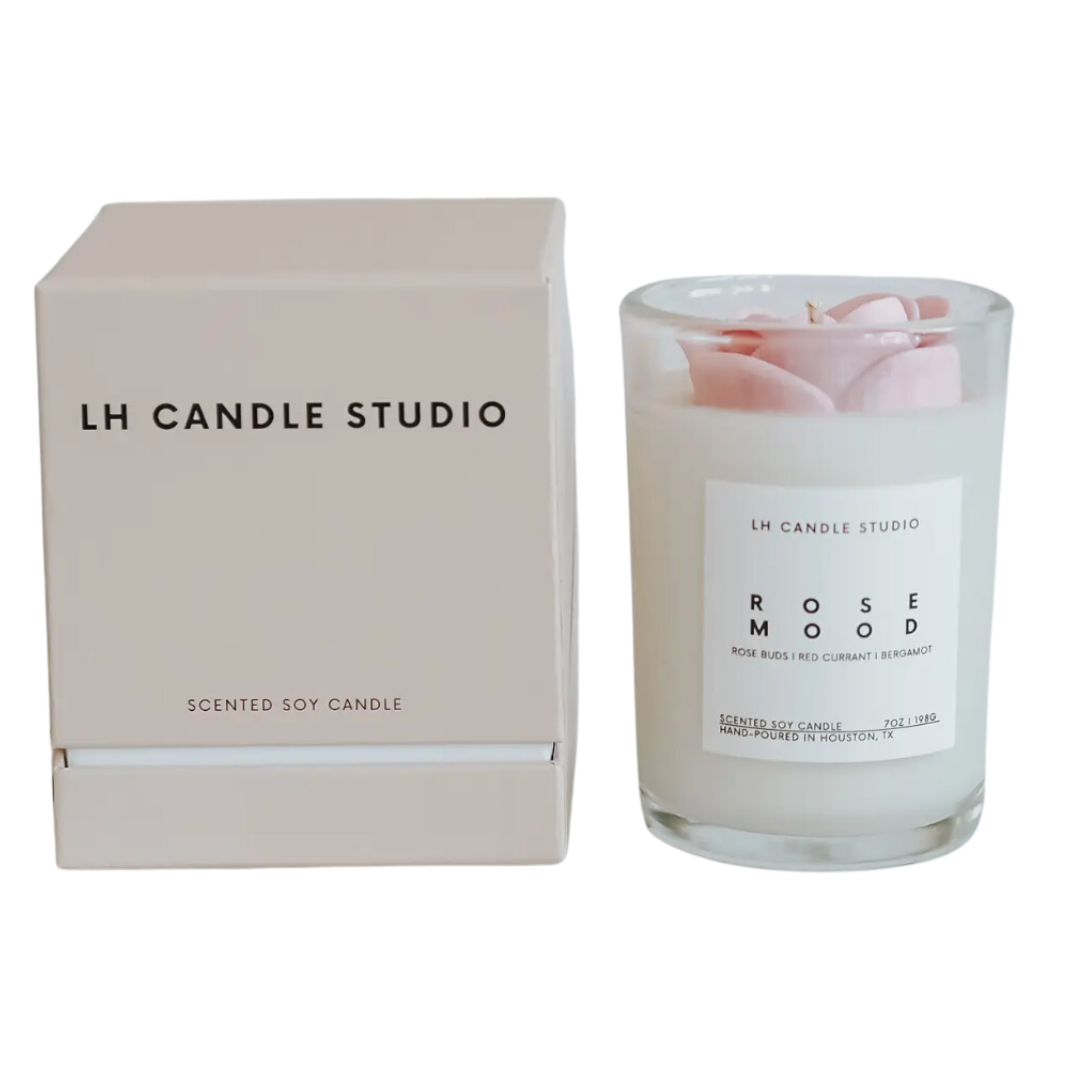 Indulge in the soothing ambiance of a soy candle, radiating rose mood fragrance.