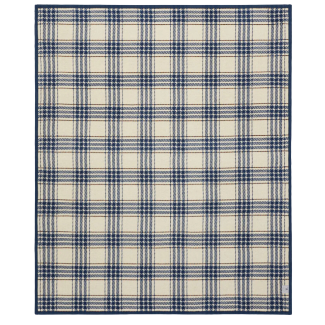Super soft oversized blanket in timeless navy and cream plaid.