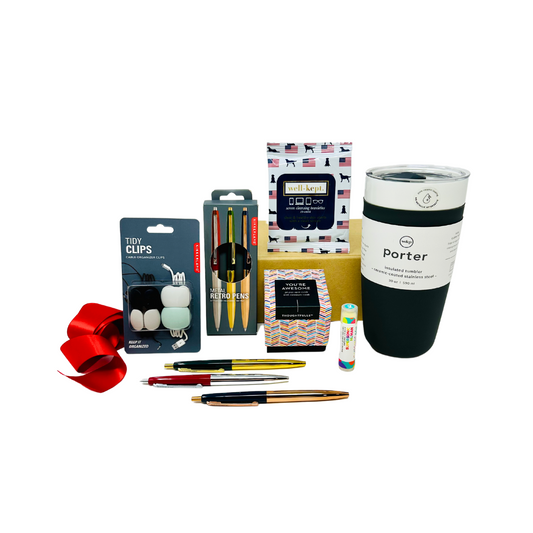 A sophisticated, curated gift box from Me To You Box, named 'On The Job.' It features premium office essentials neatly arranged, including a reusable tumbler, screen cleaner wipes, and high-quality writing instruments and more. Perfect for professionals and anyone looking to elevate their workspace.