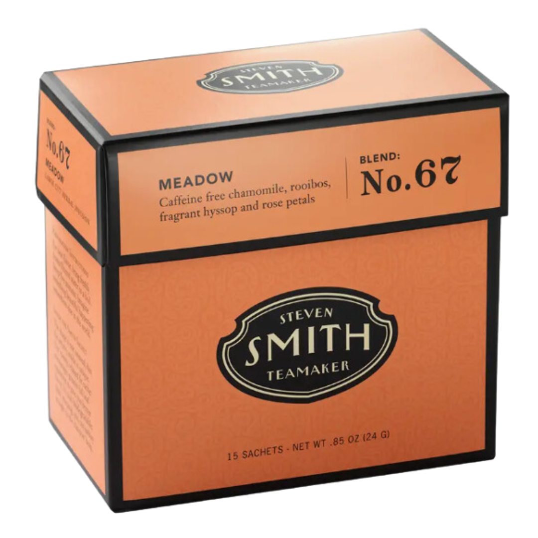 Vibrant orange box of Meadow Caffeine-Free Herbal Tea, featuring 15 individually wrapped sachets for delightful herbal infusion.