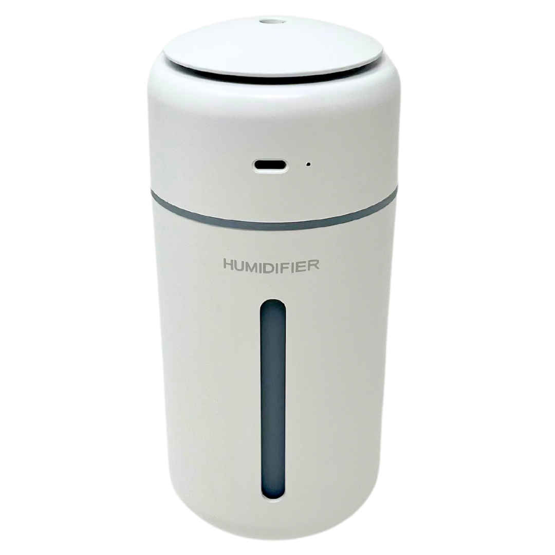 Small white portable humidifier emitting cool mist for on-the-go comfort.