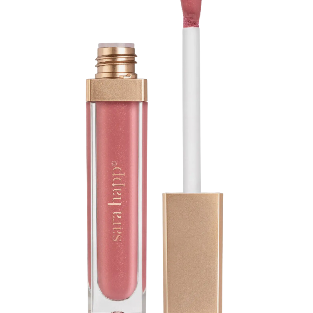 Sara Happ's Pink Slip Lip Gloss: A luscious rosy hue, delivering a glossy finish. Perfectly kissable lips in a chic bottle, available for inclusion in your custom Me To You Box.