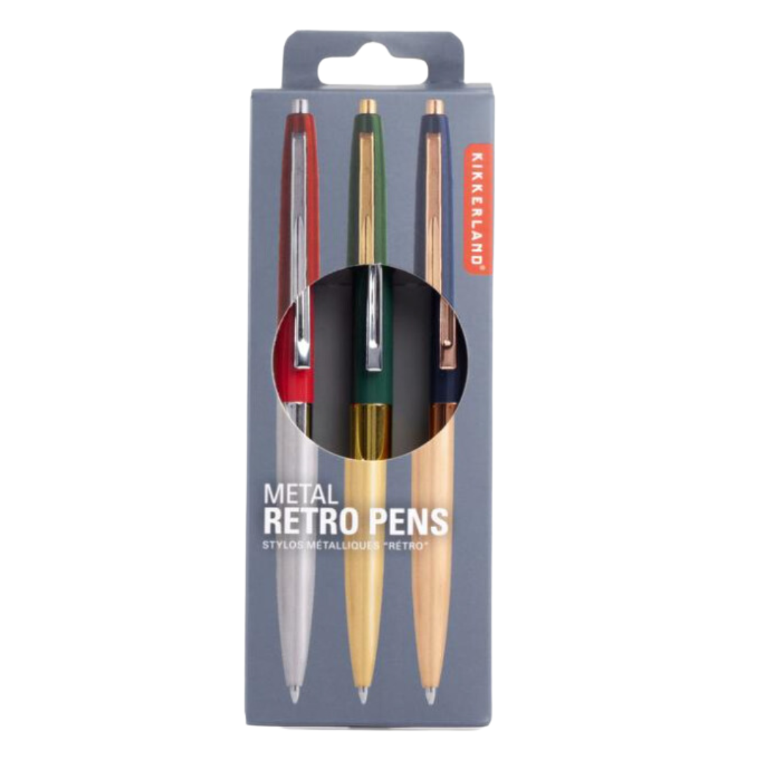 Three metallic pens arranged side by side in their box, featuring eye-catching blocks of color in red, blue, and green.