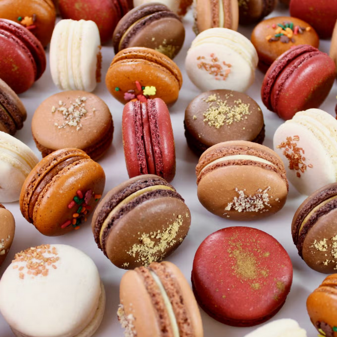 Colorful assortment of French macarons, arranged delicately, showcasing vibrant hues and flavors.