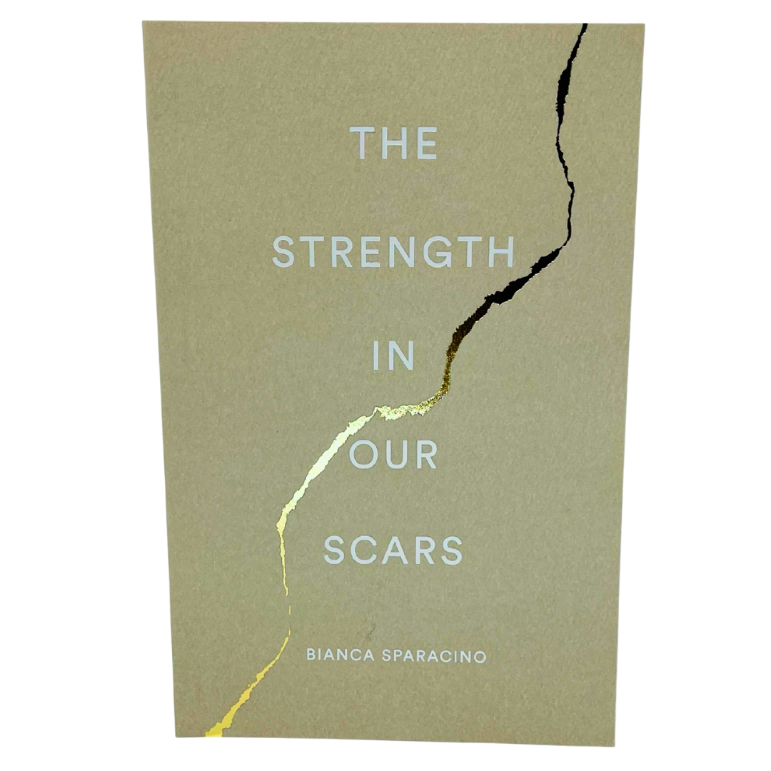 Book cover of 'The Strength in Our Scars' by Bianca Sparacino with a crack design on a beige background.