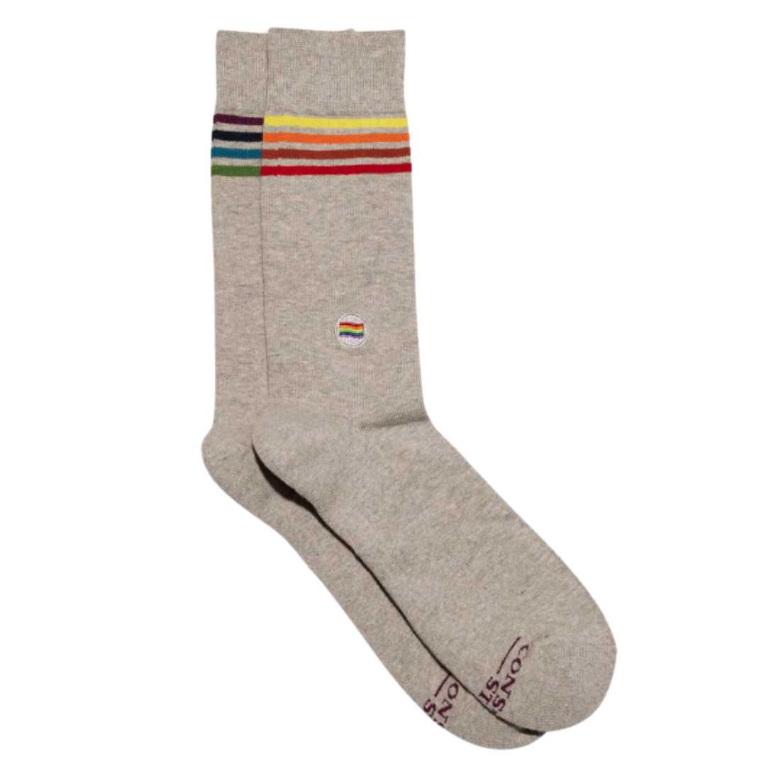 Celebrate with flair in these grey crew socks featuring bold rainbow stripes - Pride in every step!