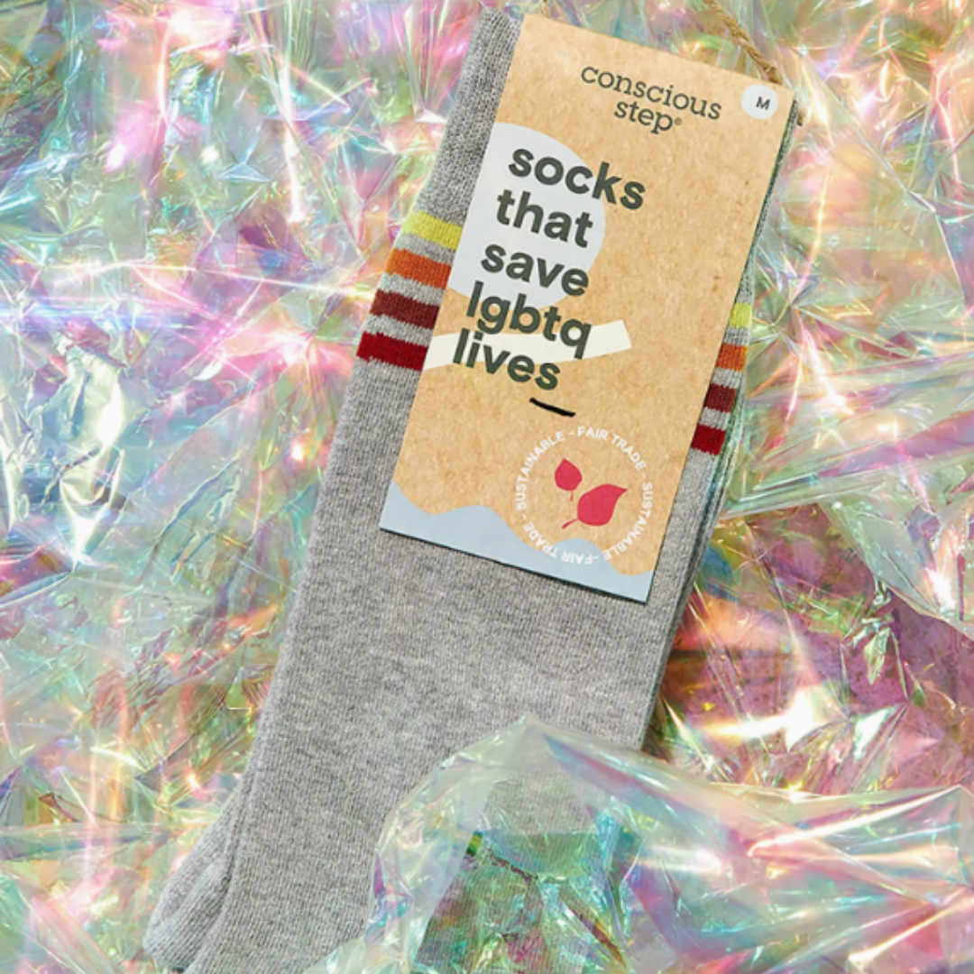 Step into pride and comfort with these grey crew socks featuring eye-catching rainbow stripes at the top.