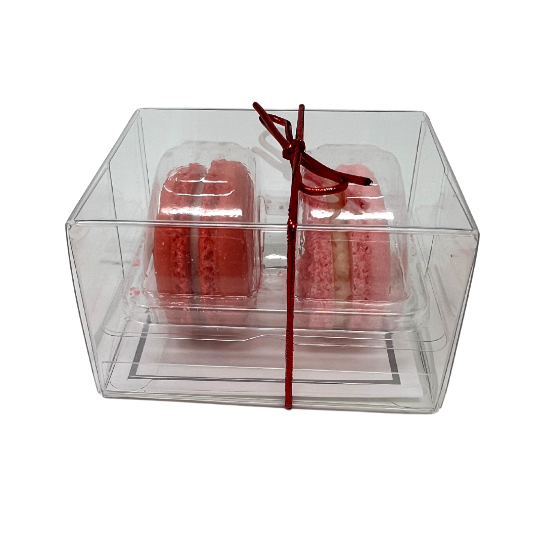 Two-pack of French macarons: cherry amaretto and strawberries & champagne flavors.