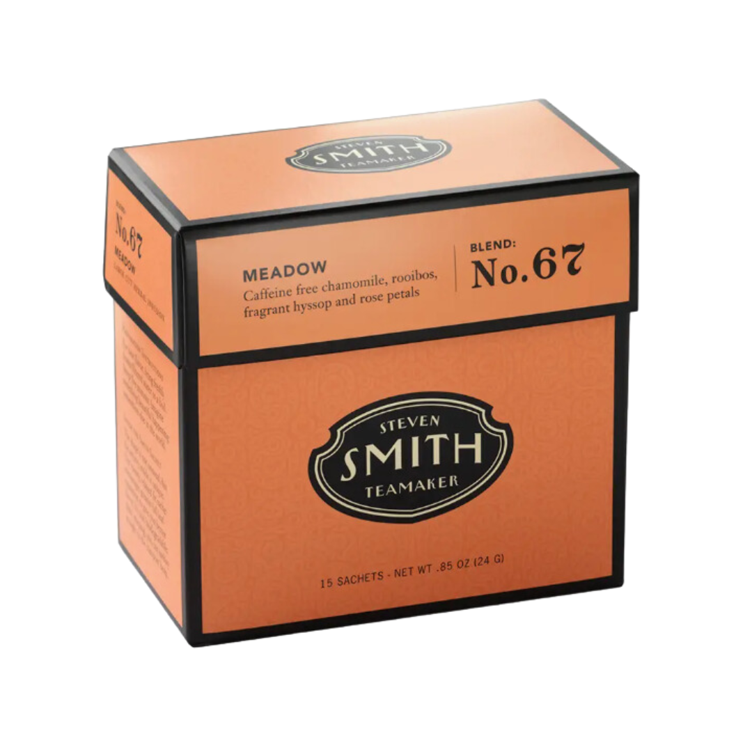 Vibrant orange box: Caffeine-free Meadow Herbal Tea by Smith Teamaker. 15 loose leaf tea sachets individually wrapped for a soothing brew.